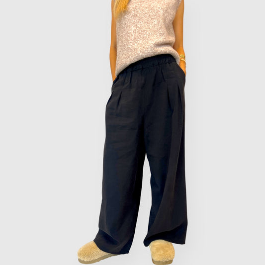 Pantalone palazzo in tessuto fluido con tasche