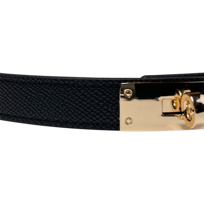 Cintura elegante effetto pelle con chiusura gioiello