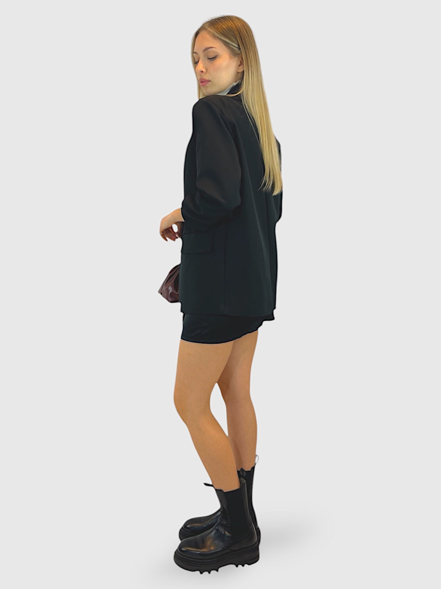 Gonna drappeggiata in satin con nodo laterale e zip sul retro