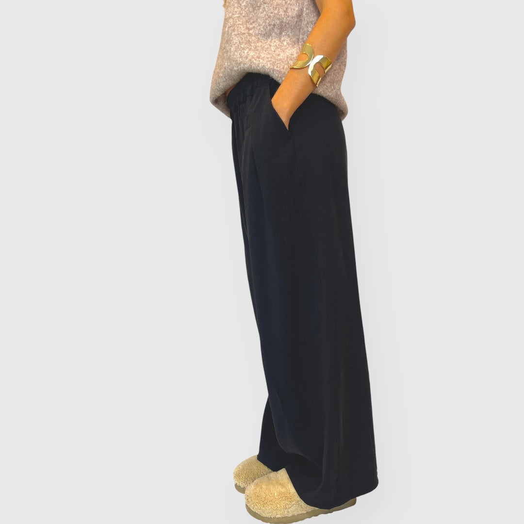 Pantalone palazzo in tessuto fluido con tasche